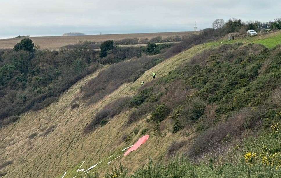 Two police officers were seen inspecting the Folkestone White Horse. Picture: Ashley Bragg