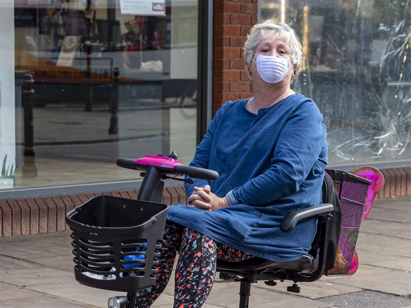 A woman wears a mask outside Wilko as shops reopened. Picture: Jo Court