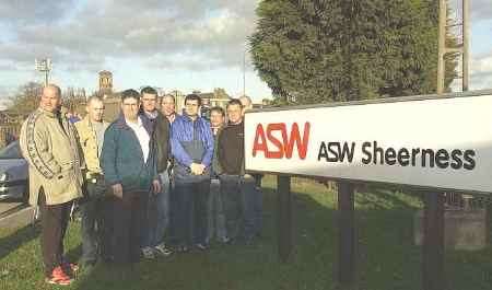 STUNNED: Some of the employees outside the plant today. Picture: MATTHEW WALKER