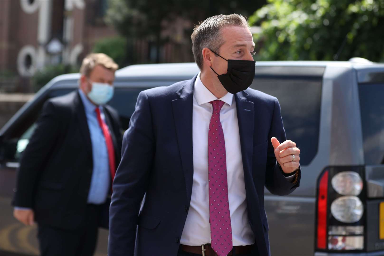 First Minister Paul Givan arrives for a visit to the PIPS Charity, north Belfast (Liam McBurney/PA)