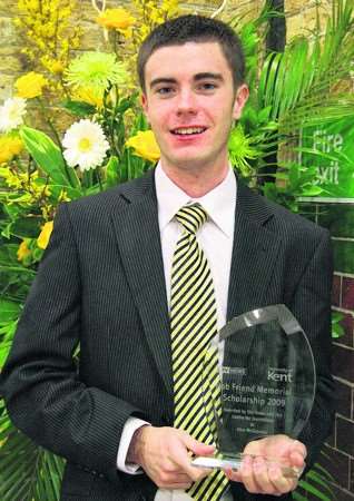 Alan McGuiness with his award