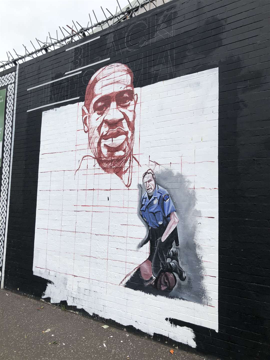 A new mural in progress on the Falls Road in Belfast (David Young/PA)