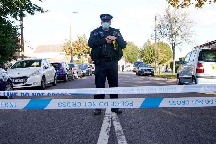 A police officer at the scene near the Belfairs Methodist Church after MP Sir David Amess was stabbed to death in Essex. Picture: PA