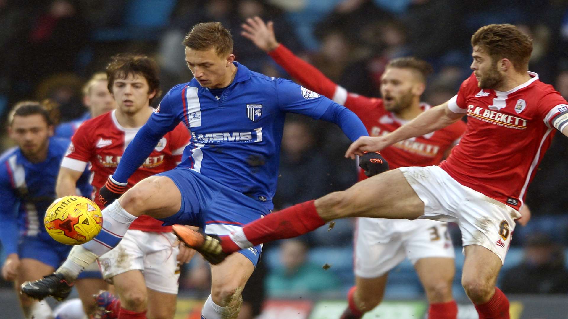 Luke Norris battles Barnsley skipper Martin Cranie Picture: Barry Goodwin