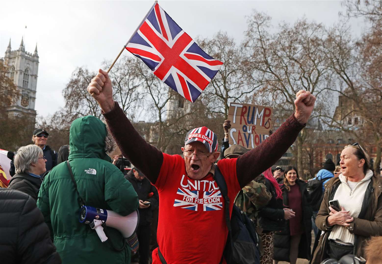 People take part in a protest in Parliament Square (Luciana Guerra/PA)