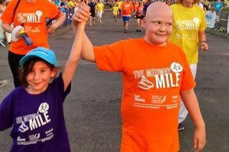 Rebecca Kelliher, eight, and Alice Gilham, 11, walked together hand in hand for Mid Kent type 1 diabetes support group