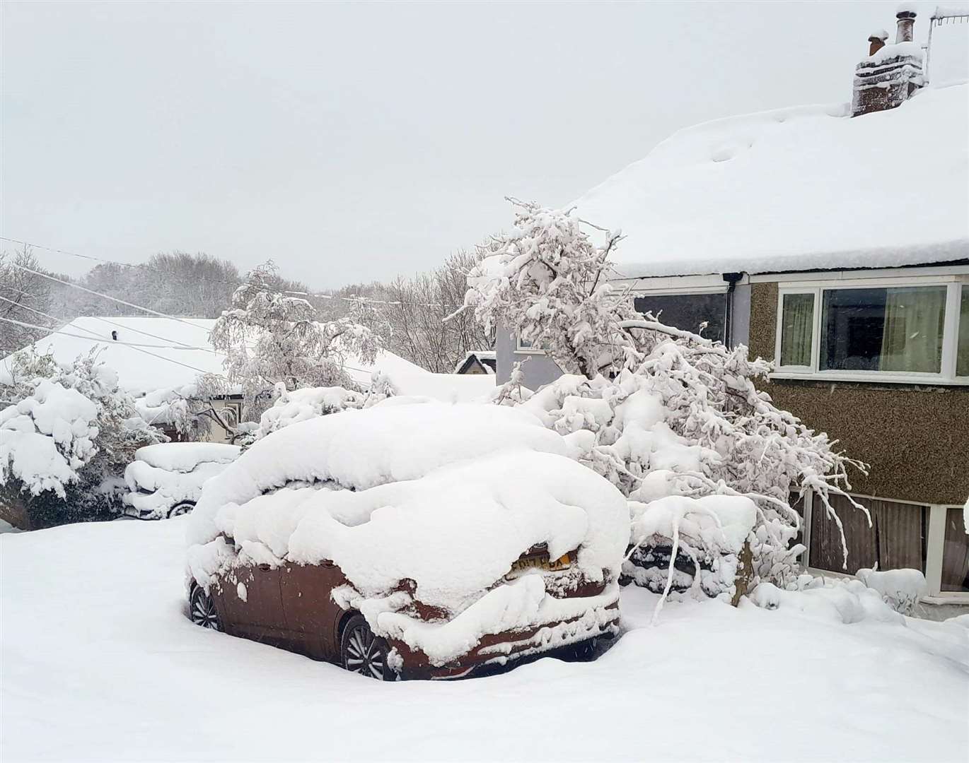 A car covered in snow in Grenoside, Sheffield (Jim Davies/PA)