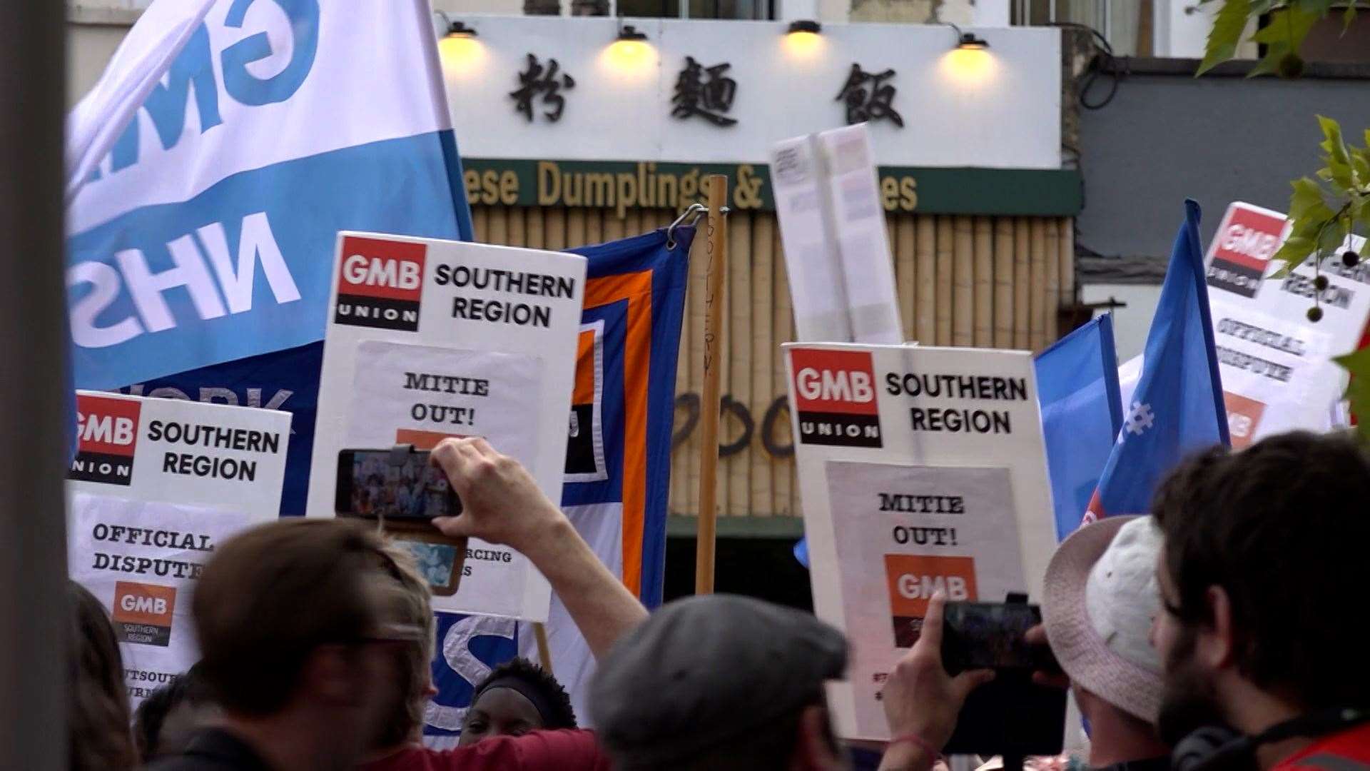 Hospital workers from St George’s Hospital in Tooting, who are in their own pay dispute, turned up to support rail workers at a rally outside King’s Cross station, London (Rebecca Speare-Cole/PA)