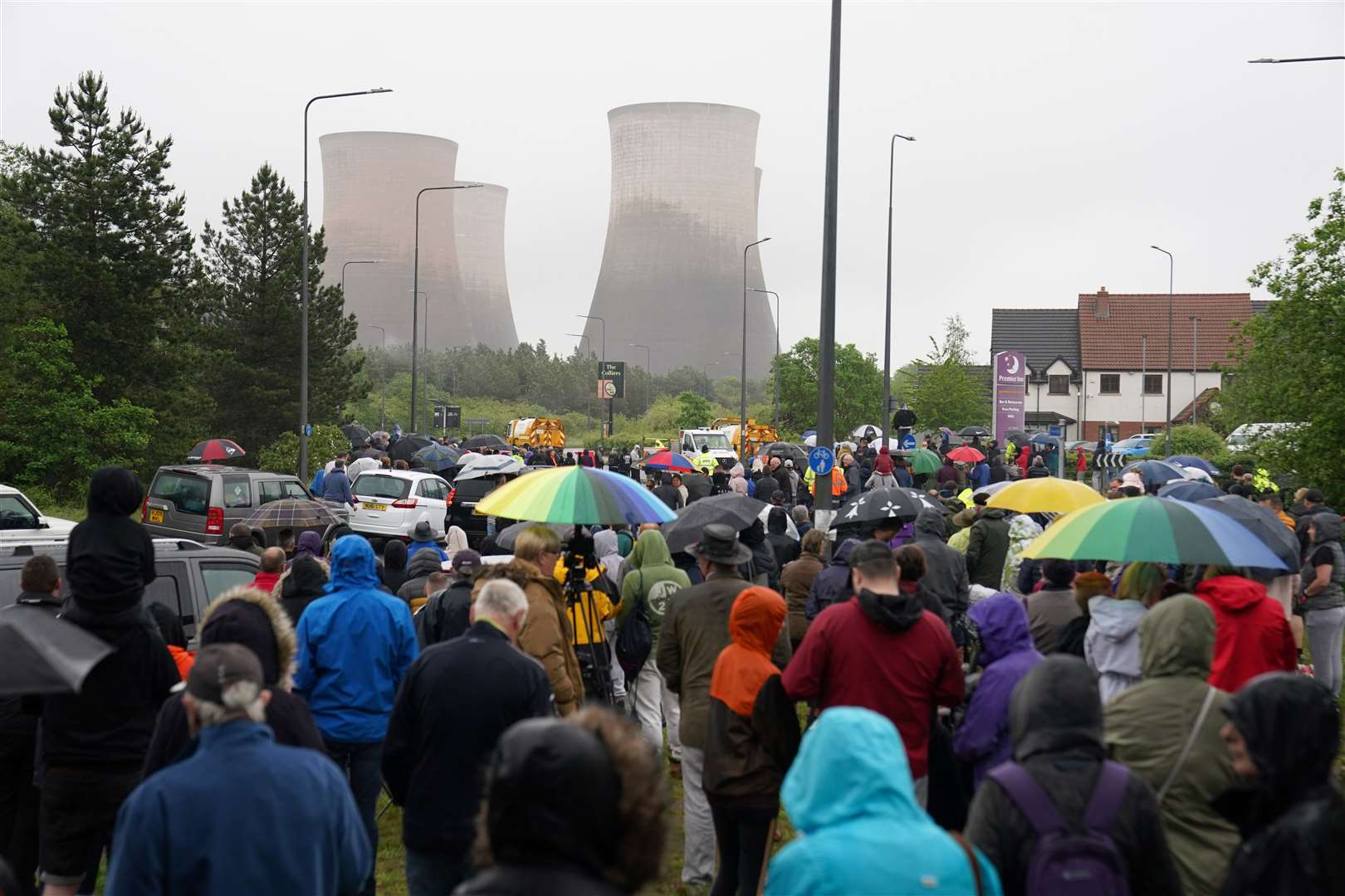 People watch the four cooling towers at Rugeley Power Station (Peter Byrne/PA)