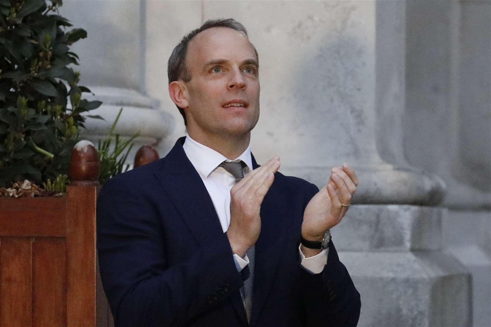 Dominic Raab clapping outside the Foreign and Commonwealth Office in London to salute local heroes during Thursday’s nationwide Clap for Carers (Tolga Akmen/PA)