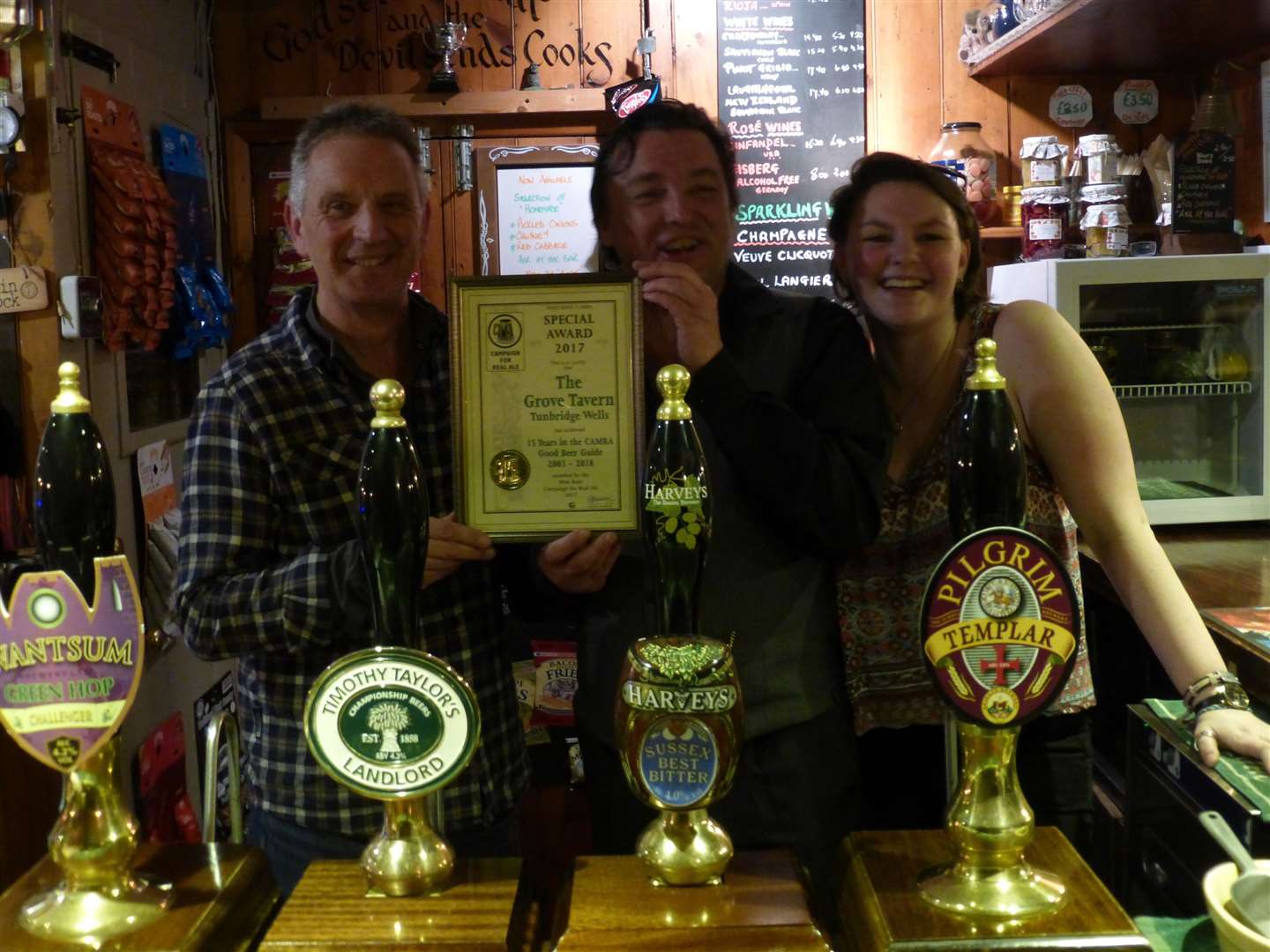 Steve Baxter, landlord of the Grove Tavern, received an award for 15 consecutive years in the Good Beer Guide from CAMRA's Craig Beeson (right) in 2017