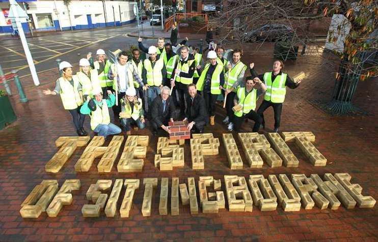 Cllr Mike Cosgrove, Rob Sloper, development director of the Cathedral Group, and a group of bricklayers outside Swale House