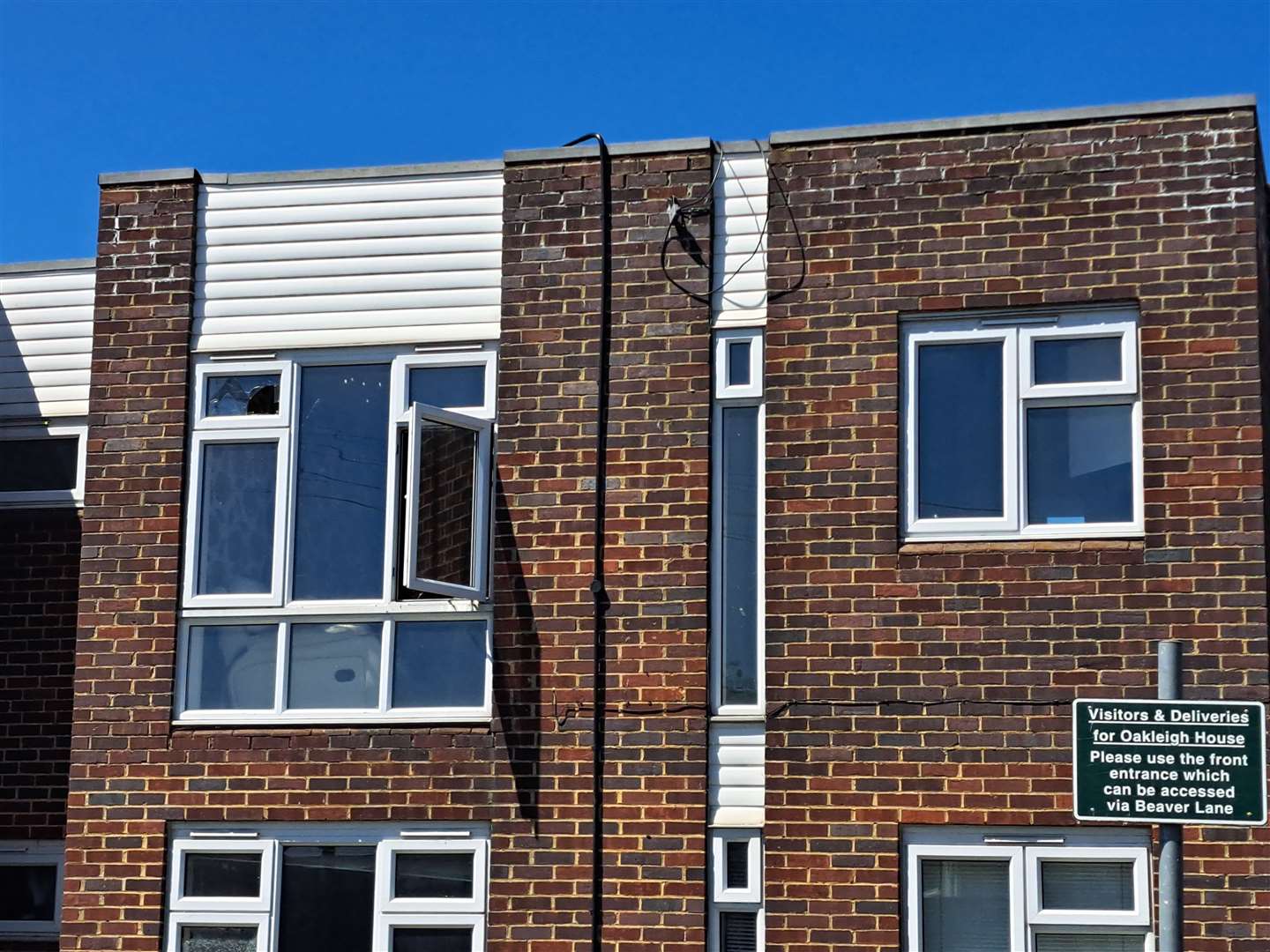 Many windows on the building have been smashed and left open