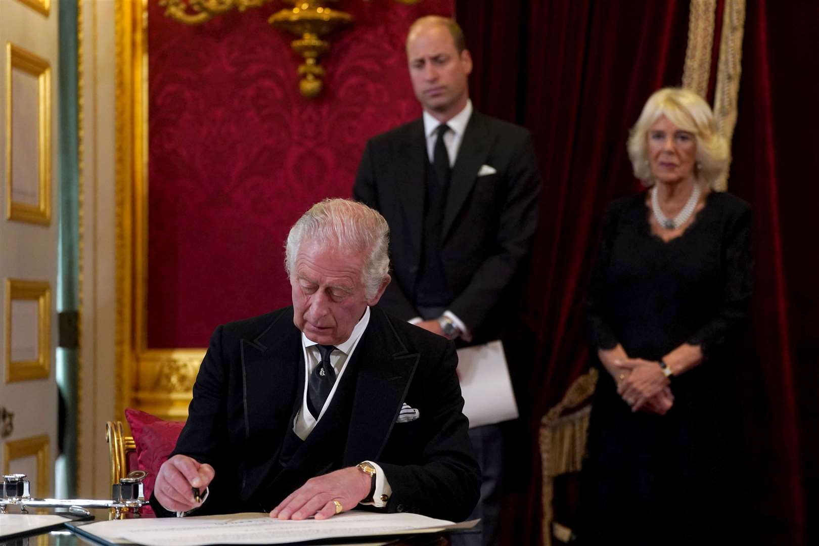 King Charles III signs an oath to uphold the security of the Church in Scotland during the Accession Council at St James’s Palace, London (Victoria Jones/PA)