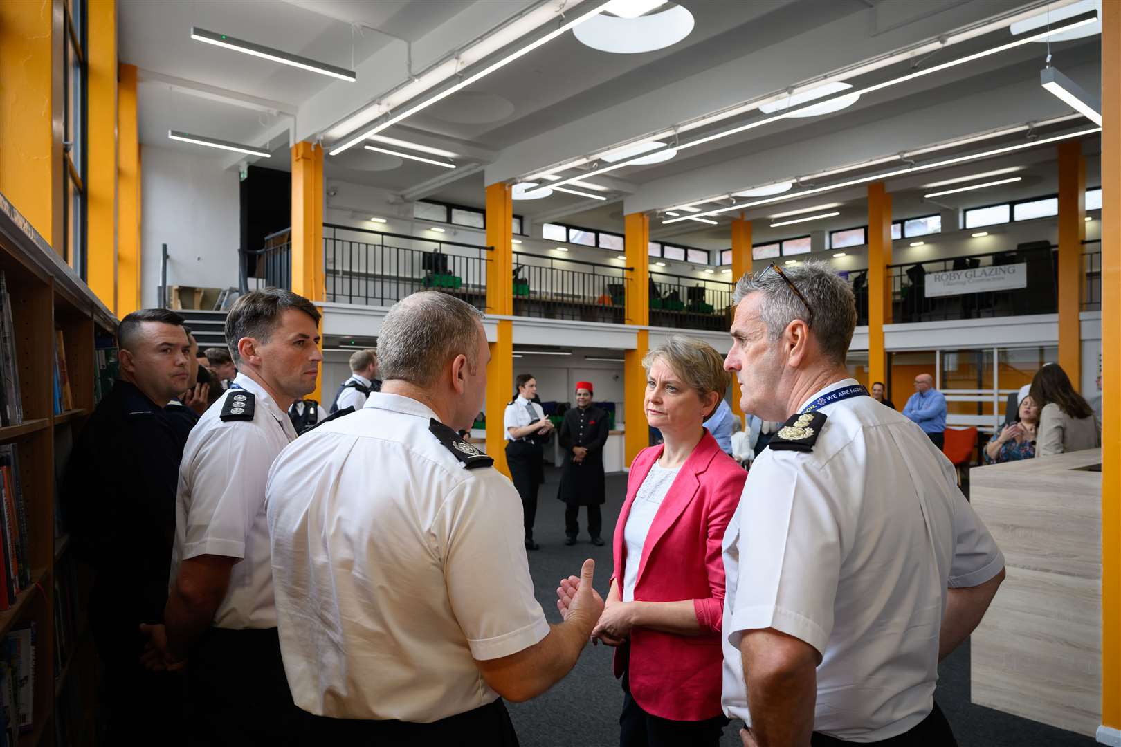 Home Secretary Yvette Cooper speaks to firefighters who were on duty during August’s riots (Leon Neal/PA)