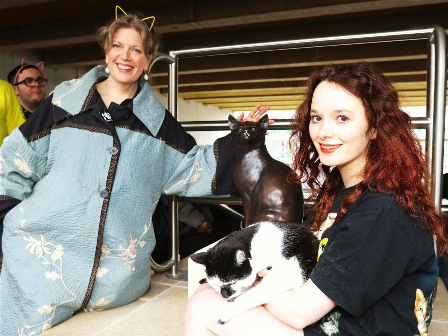 Chancellor Dr Sarah Perry and student Gracie Mullane with Pebbles the cat (University of Essex/PA)