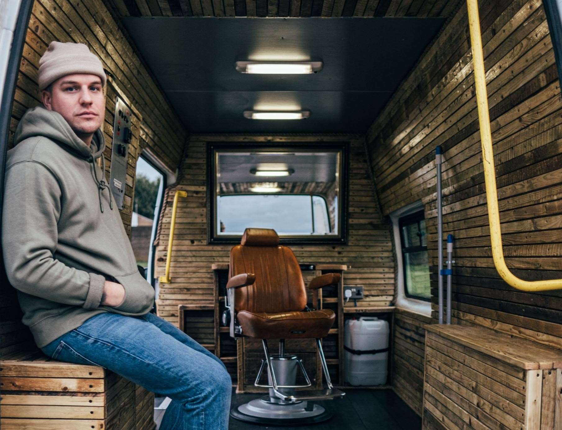 Aaron Simmons with his Busking Barber van. Picture: Aaron Simmons