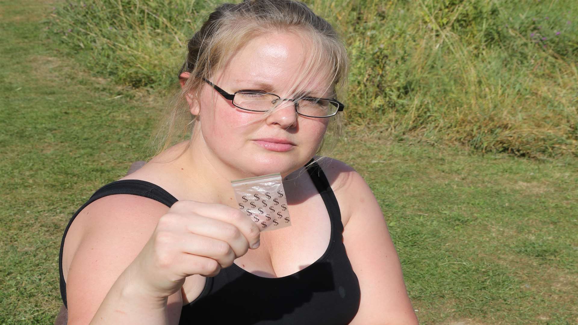 Lorraine Otway holds up a packet that might have contained a drug