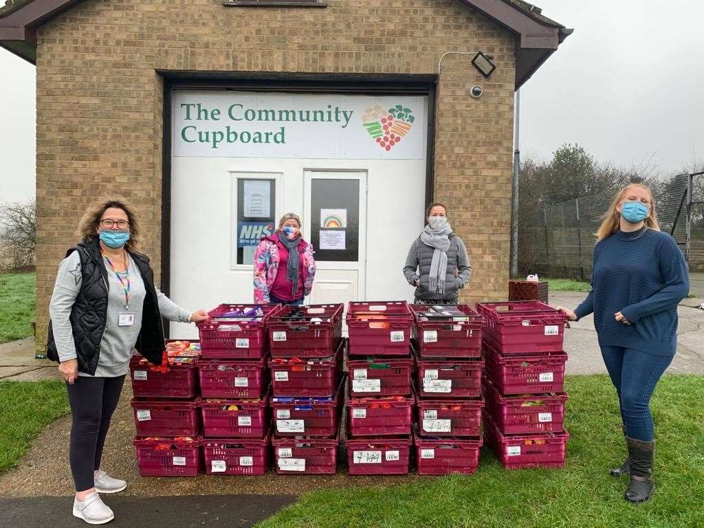 Volunteers drop the donation at The Community Cupboard