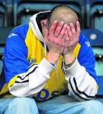 Gillingham fan after relegation at Wycombe