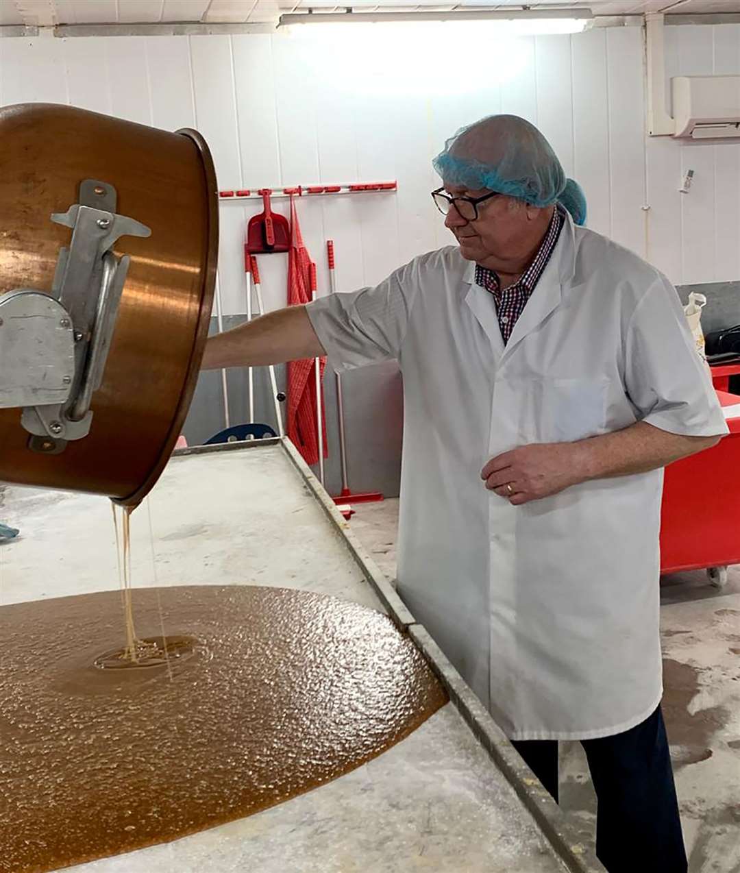 Derek Shaw, originally from Gravesend, tastels the caramel sauce at the Mackie's farm and factory as he helps work with the company to create its new Chocolate Orange Honeycomb bar. Picture: Mackie's of Scotland