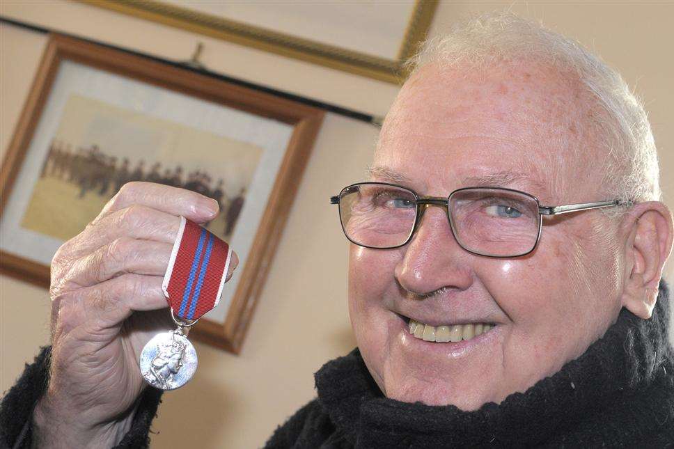 Geoffrey Jordan with his medal received for being a guardsman during Queen Elizabeth's coronation