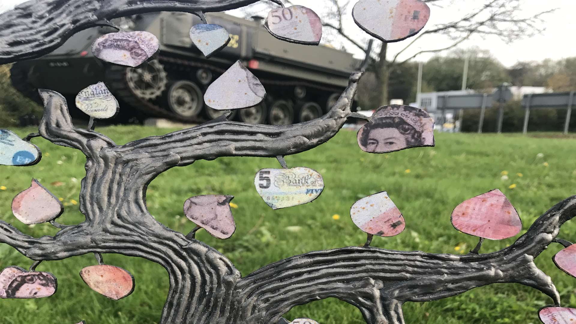 The leaves on the tree are designed to look like money