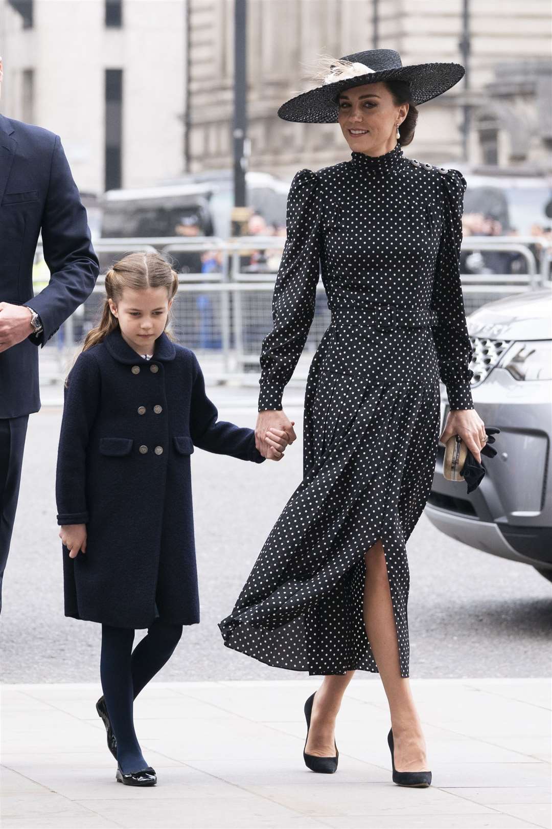 Charlotte held her mother’s hand as she met with dignitaries (Aaron Chown/PA)