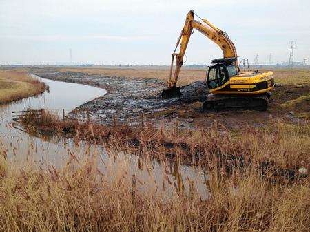 a JCB digger working on water courses near the Brielle Way flyover, on land known as Diggs Marshes.