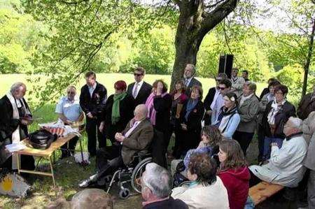 Villagers and relatives of the Stirling crew at the dedication ceremony on the site of the plane crash