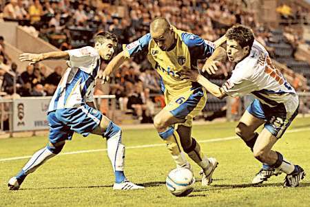 Gillingham goalscorer Curtis Weston tries to break through the Colchester defence