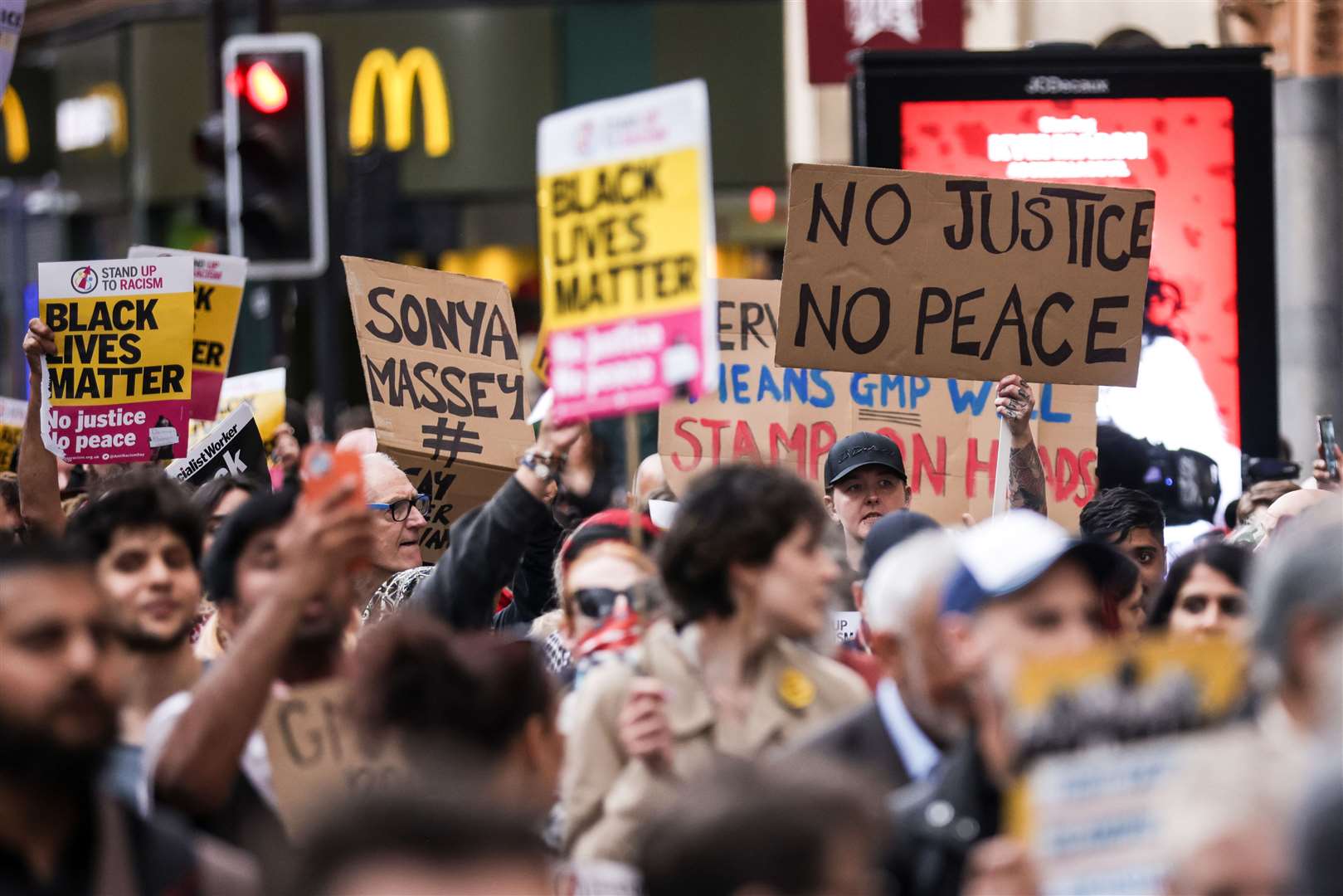 A Stand Up To Racism demonstration in Manchester after a police officer was suspended after a video which appeared to show a man being kicked as he lay on the floor (James Speakman/PA)