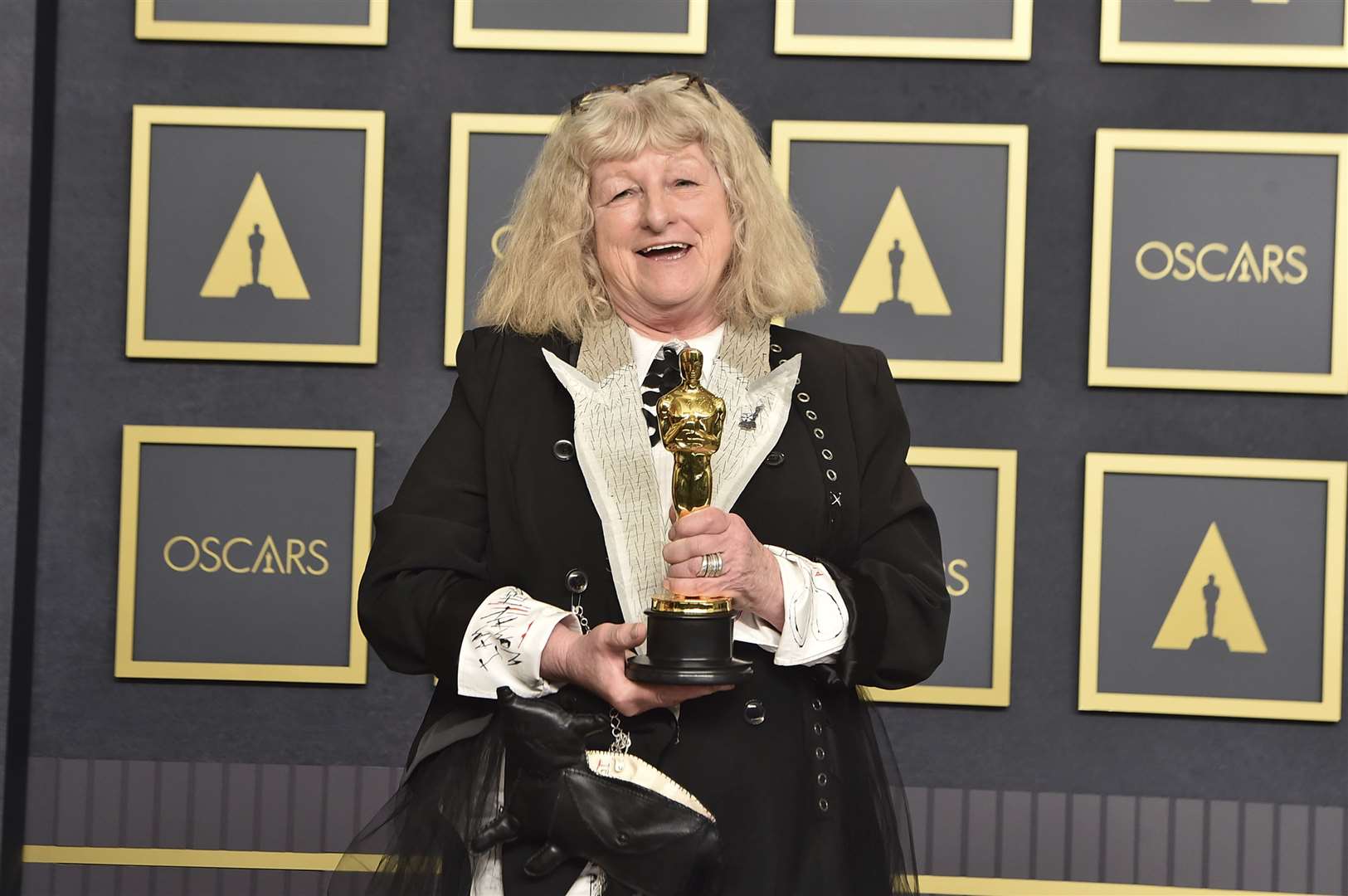 Jenny Beavan, winner of the award for best costume design for Cruella, poses in the press room at the 2022 Oscars (Jordan Strauss/AP)