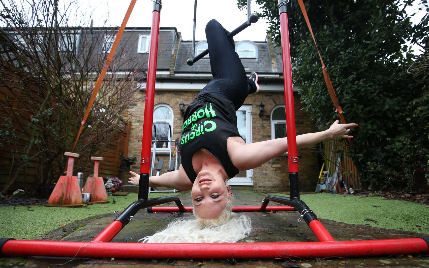 Stephanie Bates performs on an aerial rig set up at her home in London (Jonathan Brady/PA)