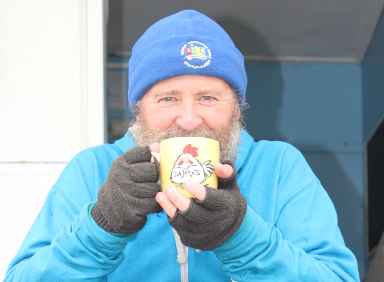 Warming up: Phil Crowder after his icy dip