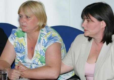 The murdered man's daughters, Sarah Bishop and Amanda Reynolds, comfort each other during the press conference. Picture: MARTIN APPS