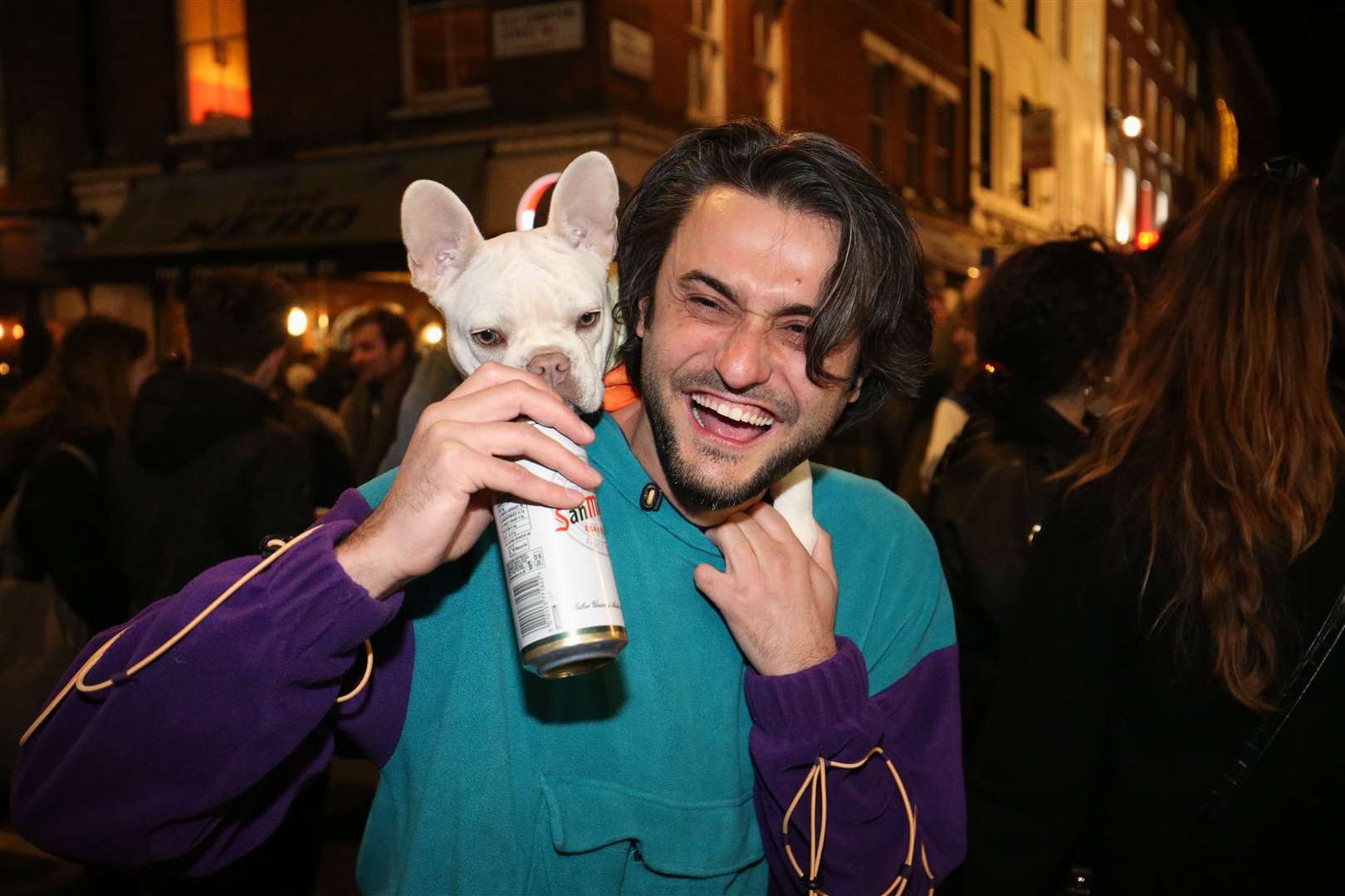 A man with a dog out in Soho, central London (Jonathan Brady/PA)