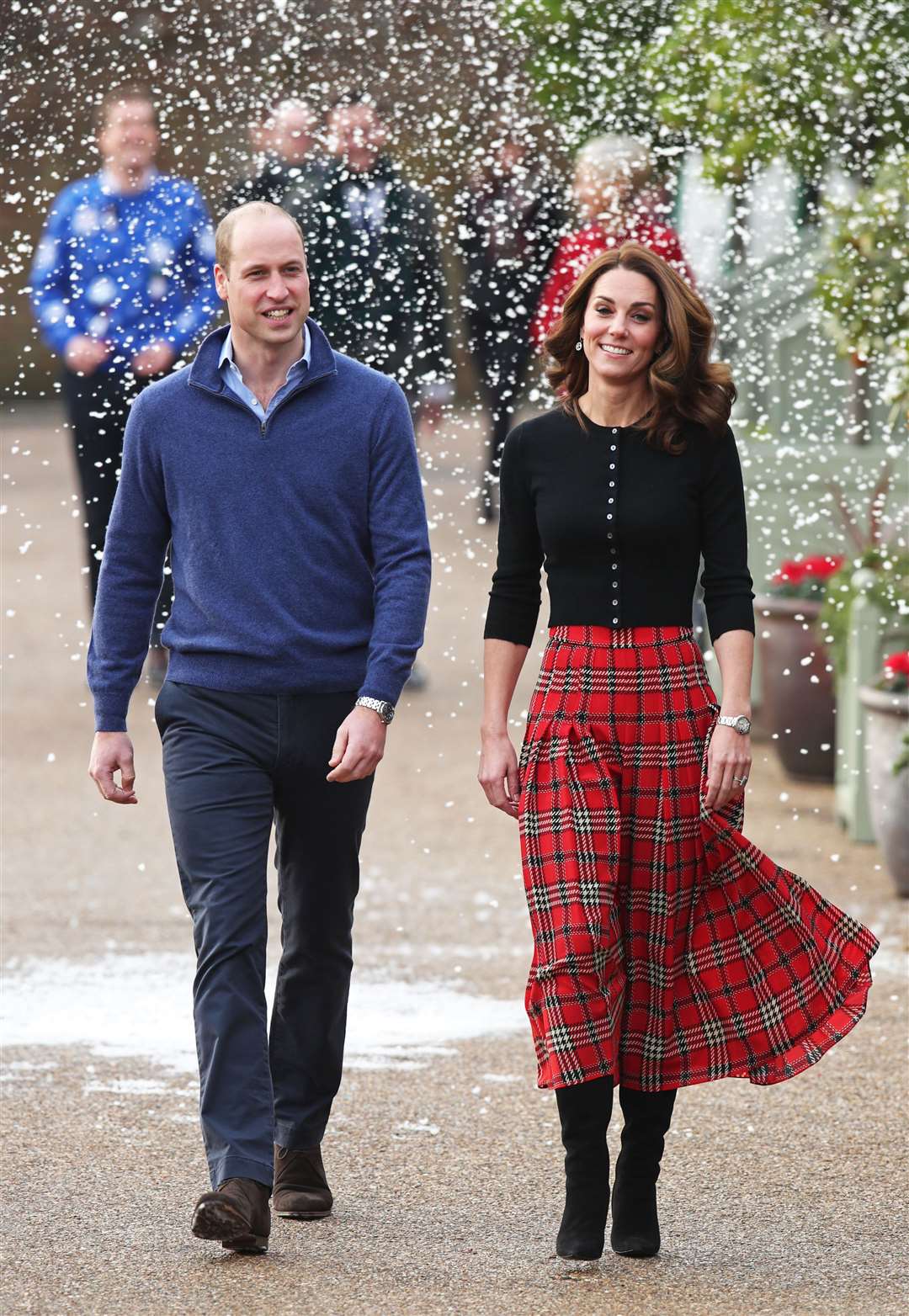 The Duke and Duchess of Cambridge arrive at Kensington Palace for the special Christmas party (Yui Mok/PA)