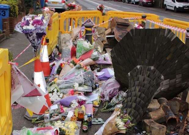 Tributes left to the two men who died after a crash on the A2 which knocked down a village monument, in 2016 (49969382)