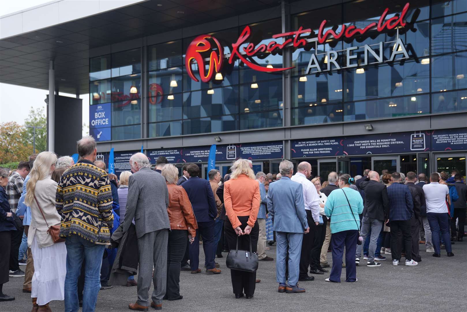 People queuing to enter the NEC in Birmingham for the Reform UK annual conference (Joe Giddens/PA)