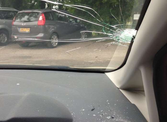 Miss Cattaneo's car dashboard was covered with glass