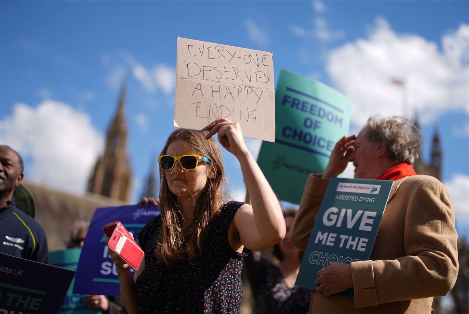 Campaigners gathered outside Parliament ahead of the debate (Jordan Pettitt/PA)