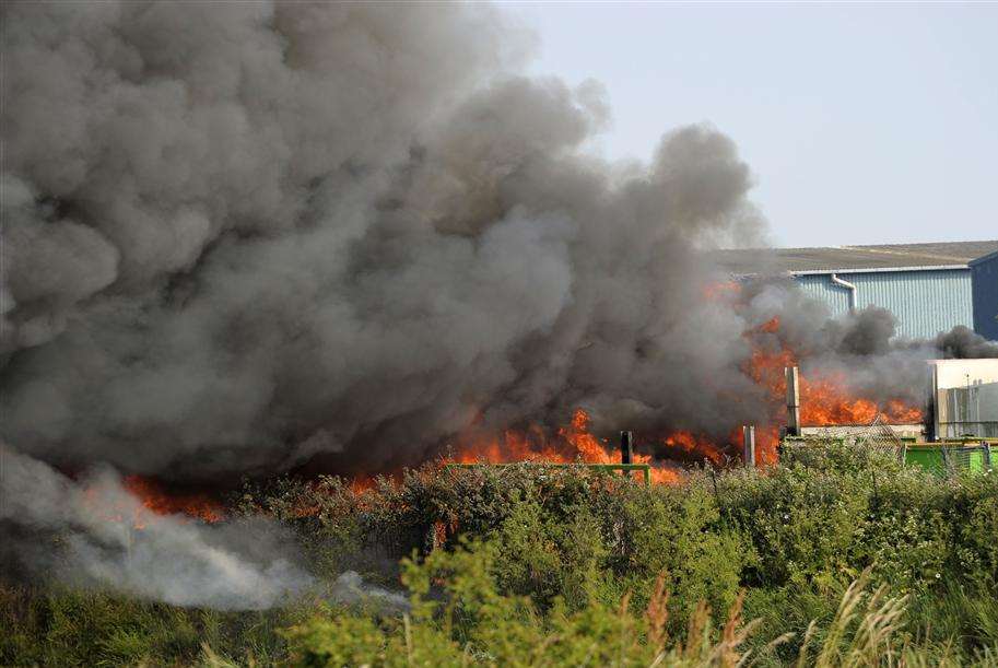 Flames and huge plumes of smoke at the recycling depot in Milton Regis. Picture: Andy Payton