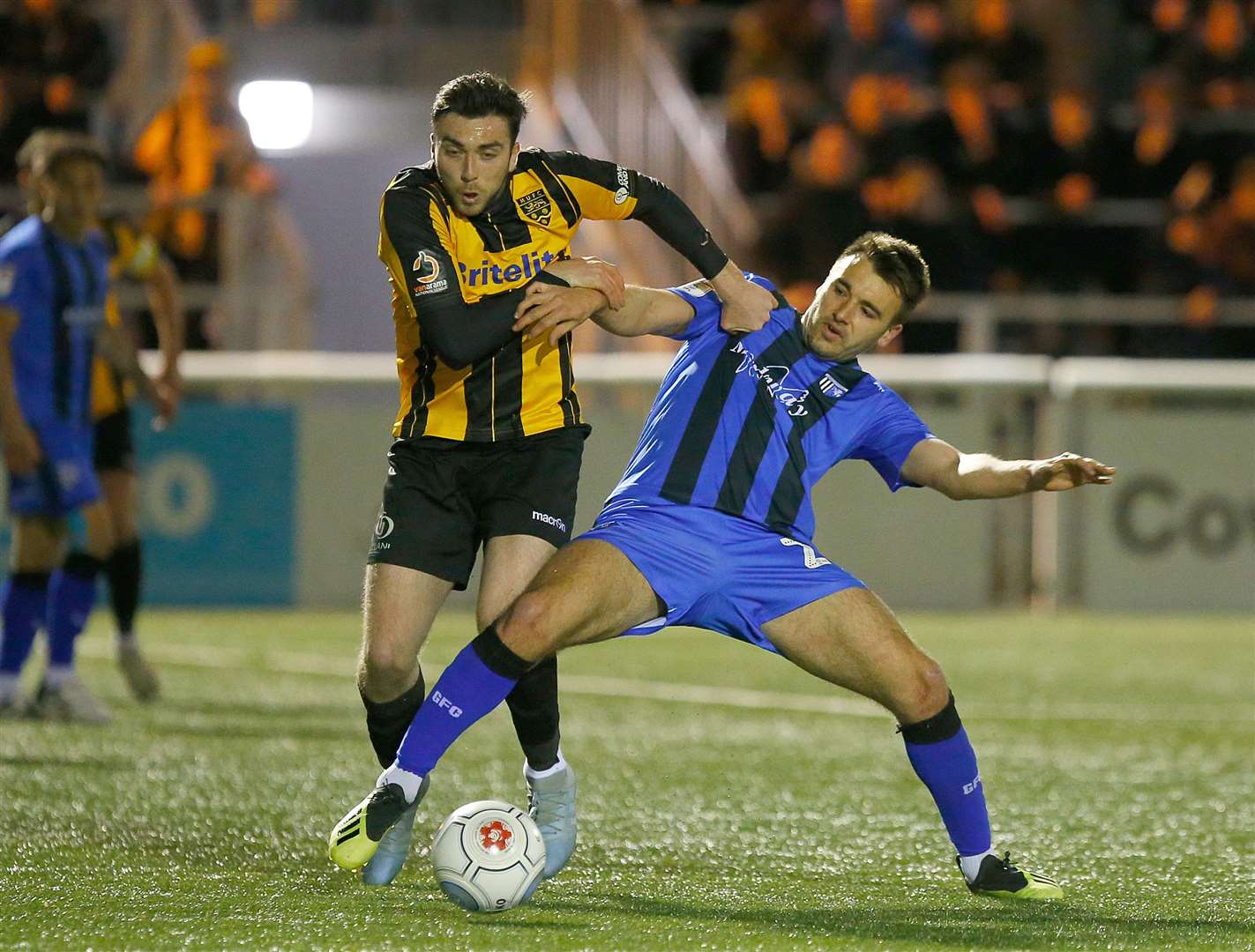 Maidstone midfielder Leo Donnellan and Gills' Josh Rees fight for possession Picture: Andy Jones