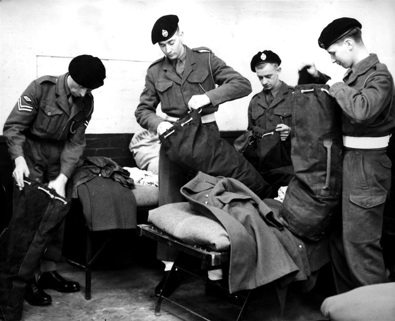 National service men of the 1st Royal Tank Regiment packing their kit at Fowler Barracks, Tidworth (PA)