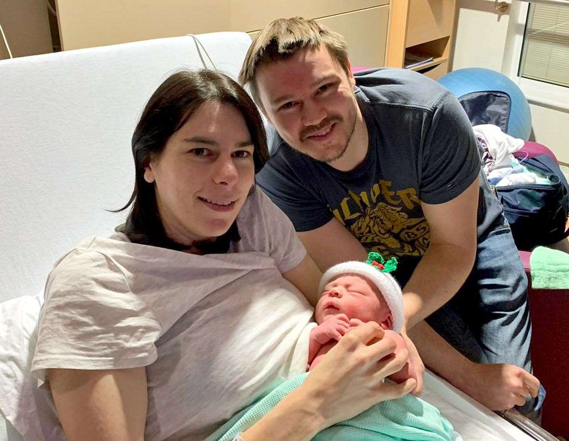 Donald and Kim Dallas with their as yet unnamed son who was born at the NHS Lothian birthing centre in Edinburgh at 4.10am weighing 9lbs 2oz (NHS Lothian/PA)