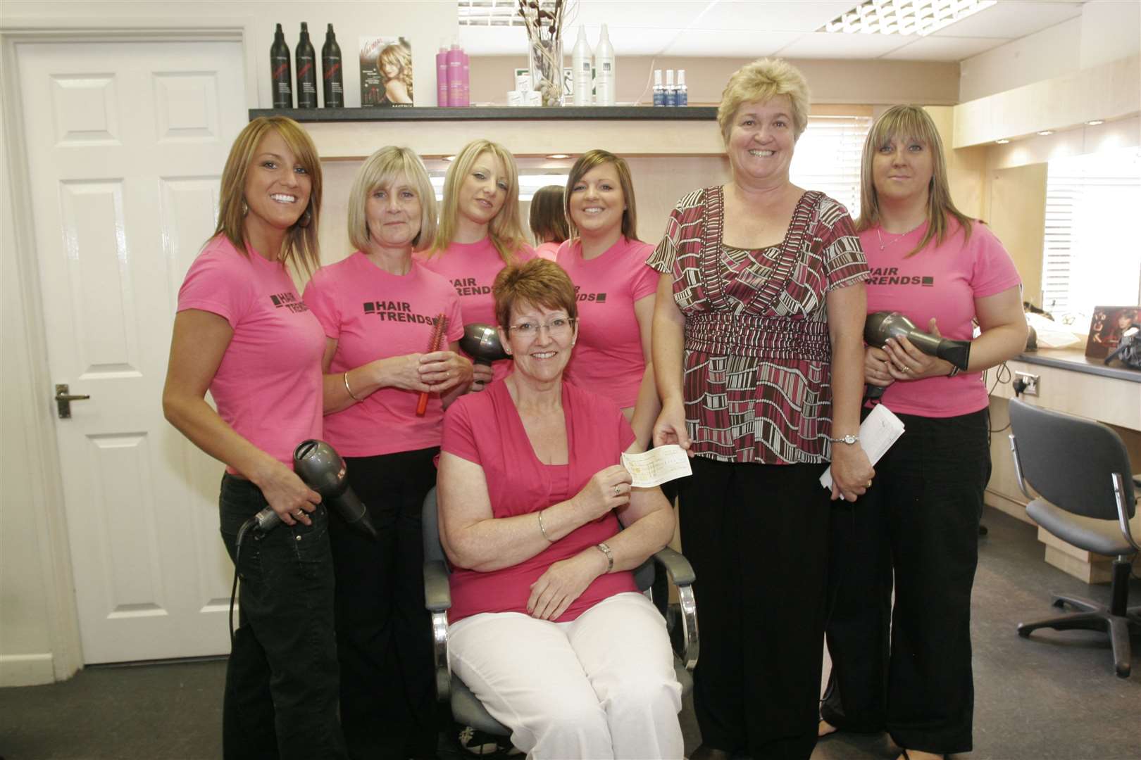 The team in 2008 handing a cheque over after raising money for the McMillan Centre Care Unit at Medway Maritime Hospital. Picture: Peter Still