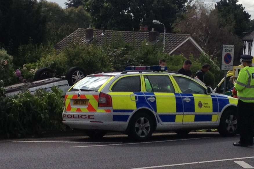 The car landed upside down in a front garden