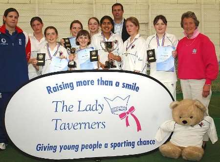 WINNING TEAM : members of the under 13 side with Rachel Heyhoe-Flint, right, former England bowler Tim Munton, at the rear, and current England player Nicky Shaw, left. Picture courtesy BIPIN PATEL