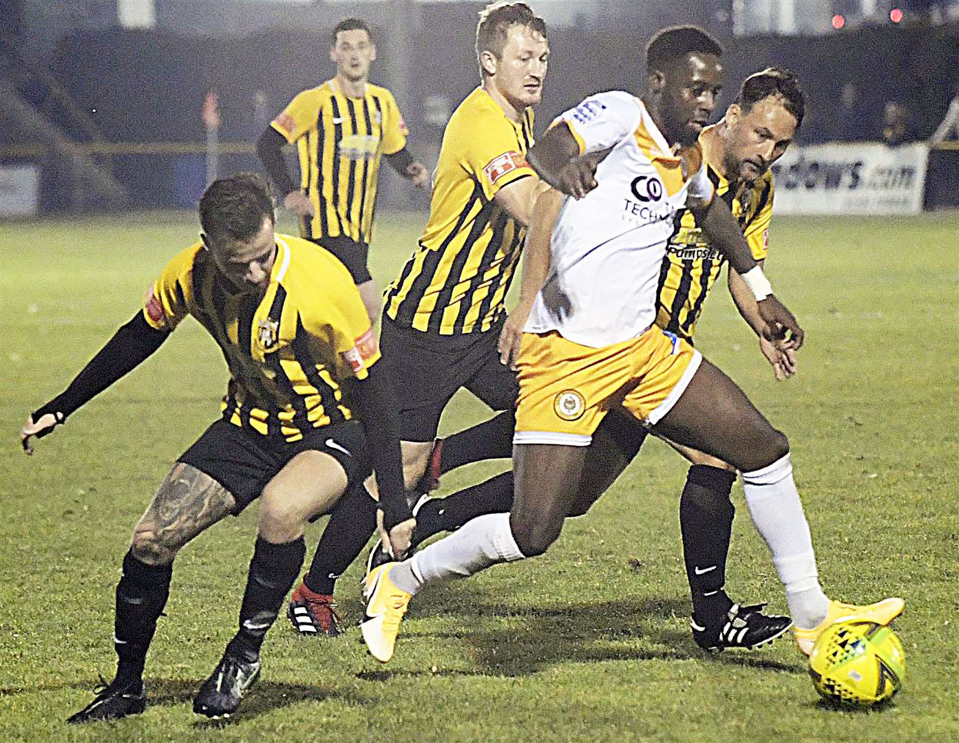 Cray Wanderers' Rhys Murrell-Williamson is surrounded by Folkestone defenders. Picture: Barry Goodwin (42483820)